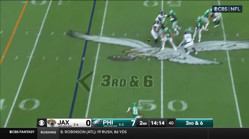 Saquon Barkley breaks a tackle, spins away and hurdles another defender